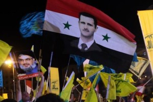 519592-portraits-du-president-syrien-bachar-al-assad-et-de-hassan-nasrallah-dirigeant-en-exil-du-hezbollah-