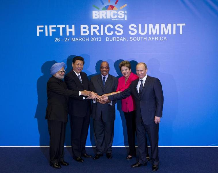 Indian Prime Minister Singh, Chinese President Xi, South African President Zuma, Brazilian President Rousseff and Russian President Putin pose for a family photograph during the fifth BRICS Summit in Durban