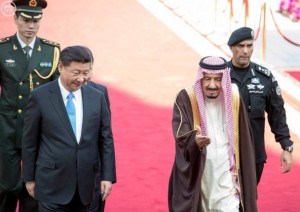 Saudi King Salman walks with Chinese President Xi Jinping during a welcoming ceremony in Riyadh