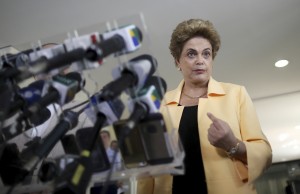 President Rousseff addresses a news conference after visiting the new Embraer KC 390 military transport aircraft in Brasilia